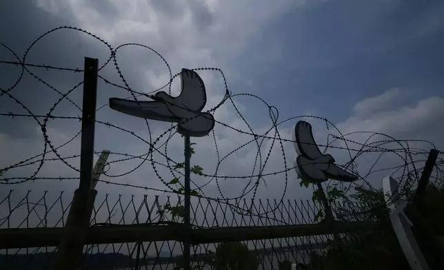 A symbolic structure remains to commemorate the removal of the military barbed-wire fence in Goyang, South Korea, Friday, July 3, 2026. (AP Photo/Lee Jin-man)