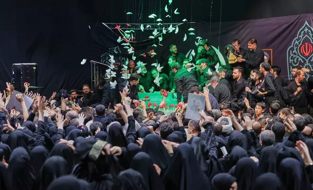 In this photo released by Iran's Supreme Leader's office, mourners gather around the coffin of Iran's Supreme Leader Ayatollah Ali Khamenei as it lies in a mourning hall adjacent to the Imam Khomeini Hussainiya within the Supreme Leader's compound before his funeral in Tehran, Iran, late Thursday, July 2, 2026. (Office of the Iranian Supreme Leader via AP)