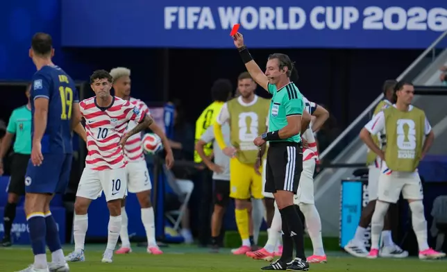 Referee Raphael Claus, of Brazil, shows the red card to United States' Folarin Balogun, unseen, during the World Cup round of 32 soccer match between the United States and Bosnia in Santa Clara, Calif., near San Francisco, Wednesday, July 1, 2026. (AP Photo/Eugene Hoshiko)