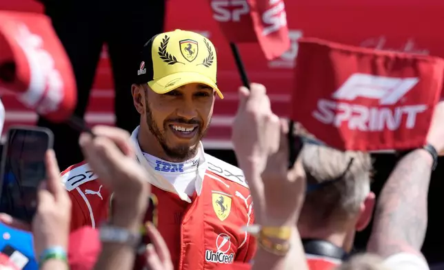 Ferrari driver Lewis Hamilton of Britain celebrates his second position after the sprint race ahead of the British F1 Grand Prix, in Silverstone, England, Saturday, July 4, 2026. (AP Photo/Darko Bandic)