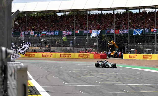 Mercedes driver Andrea Kimi Antonelli of Italy crosses the finish line to win the sprint race at the British F1 Grand Prix, in Silverstone, England, Saturday, July 4, 2026. (Peter Powell/Pool via AP)
