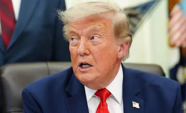 President Donald Trump speaks in the Oval Office of the White House about Dulles International Airport modernization, Wednesday, July 29, 2026, in Washington. (AP Photo/Julia Demaree Nikhinson)
