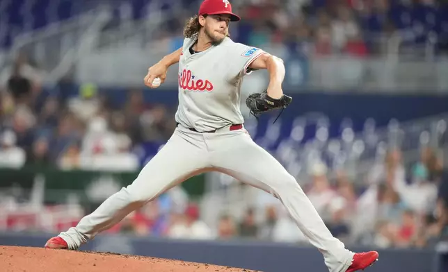Philadelphia Phillies pitcher Aaron Nola throws during the first inning of a baseball game against the Miami Marlins, Tuesday, July 28, 2026, in Miami. (AP Photo/Lynne Sladky)