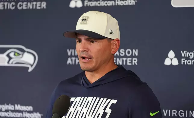 Seattle Seahawks head coach Mike Macdonald speaks to the media during the NFL football team's training camp, Saturday, July 25, 2026, in Renton, Wash. (AP Photo/Lindsey Wasson)