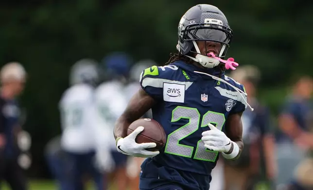 Seattle Seahawks wide receiver Rashid Shaheed runs with the ball during the NFL football team's training camp, Saturday, July 25, 2026, in Renton, Wash. (AP Photo/Lindsey Wasson)