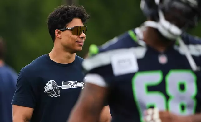 Seattle Seahawks running back Zach Charbonnet walks off the field during the NFL football team's training camp, Saturday, July 25, 2026, in Renton, Wash. (AP Photo/Lindsey Wasson)