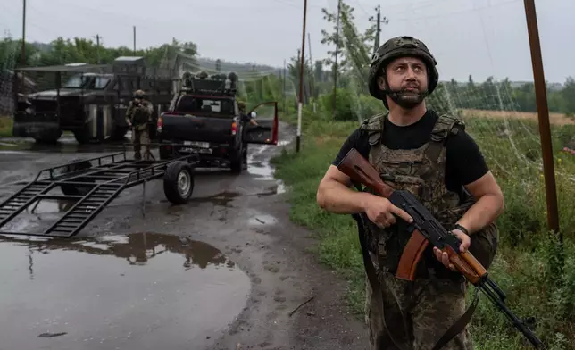 In this photo provided by Ukraine's 93rd Kholodnyi Yar Separate Mechanized Brigade press service, a Ukrainian serviceman watches an FPV drone in the frontline city of Druzhkivka, Donetsk region, Ukraine Friday, July 10, 2026. (Iryna Rybakova/Ukraine's 93rd Mechanized Brigade via AP)
