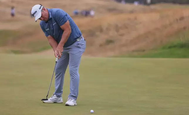 Ryan Fox of New Zealand putts on the 10th green during the third day of the British Open Golf championships at Royal Birkdale golf club, in Southport, England, Saturday, July 18, 2026. (AP Photo/Peter Morrison)