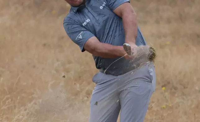 Ryan Fox of New Zealand plays from the rough on the 13th hole during the third day of the British Open Golf championships at Royal Birkdale golf club, in Southport, England, Saturday, July 18, 2026. (AP Photo/Peter Morrison)