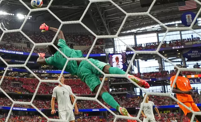 Norway's Antonio Nusa (20) scores their opening goal past Ivory Coast goalkeeper Yahia Fofana (1) during the World Cup round of 32 soccer match between Ivory Coast and Norway in Arlington, Texas, near Dallas, Tuesday, June 30, 2026. (AP Photo/Julio Cortez)