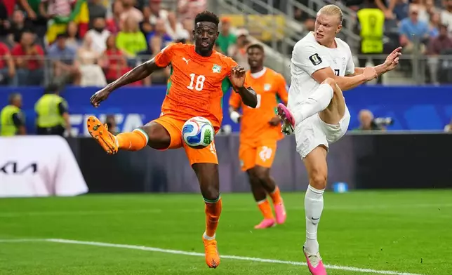 Norway's Erling Haaland (9) kicks the ball past Ivory Coast's Ibrahim Sangare (18) during the World Cup round of 32 soccer match between Ivory Coast and Norway in Arlington, Texas, near Dallas, Tuesday, June 30, 2026. (AP Photo/Julio Cortez)