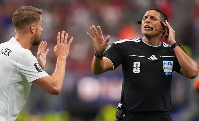 Norway's Kristoffer Ajer (3) argues with referee Jesus Valenzuela Saez, of Venezuela, during the World Cup round of 32 soccer match between Ivory Coast and Norway in Arlington, Texas, near Dallas, Tuesday, June 30, 2026. (AP Photo/Julio Cortez)