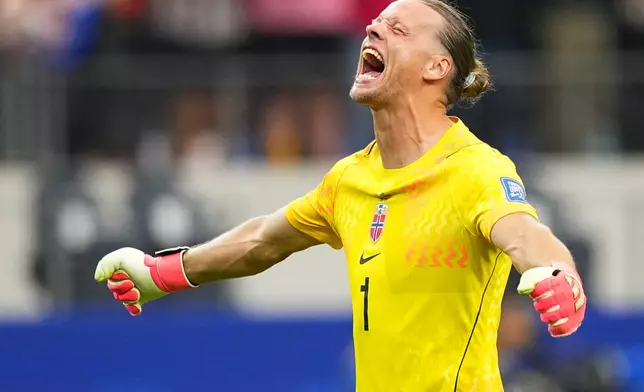 Norway goalkeeper Oerjan Nyland (1) reacts after Erling Haaland (9) scored his side's second goal during the World Cup round of 32 soccer match between Ivory Coast and Norway in Arlington, Texas, near Dallas, Tuesday, June 30, 2026. (AP Photo/Julio Cortez)