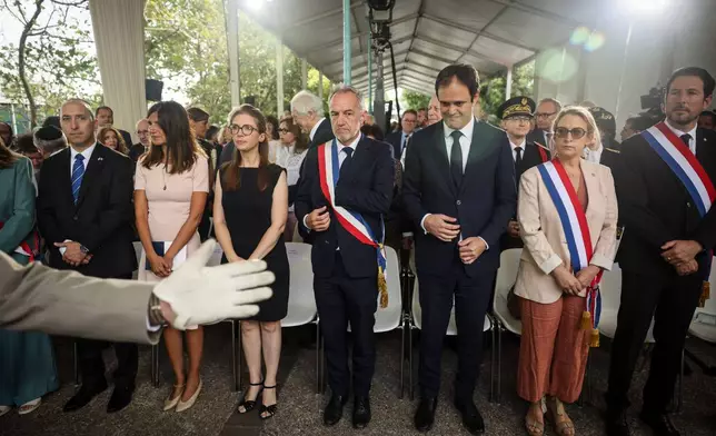 Alice Rufo, Minister Delegate to the Minister of the Armed Forces and Veterans, second left, Aurore Bergé, Minister Delegate for Equality between Women and Men and the Fight against Discrimination, third left, Emmanuel Gregoire Paris mayor, center, and Yonathan Arfi, President of CRIF (Representative Council of Jewish Institutions in France), third right, attend the ceremony marking the 84th anniversary of the 1942 Vel d'Hiv police roundup, the largest roundup of Jews in France during World War II, and paying tribute to the Righteous Among the Nations of France in Paris, Sunday, July 19, 2026. (AP Photo/Thomas Padilla)
