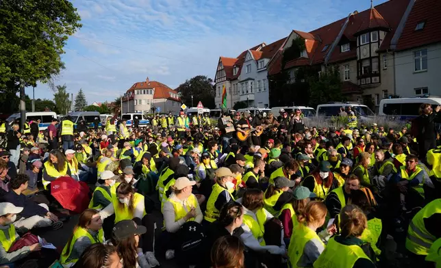 Protesters gather before a party convention of Alternative for Germany, or AfD in Erfurt, Germany, Saturday, July 4, 2026. (AP Photo/Ebrahim Noroozi)