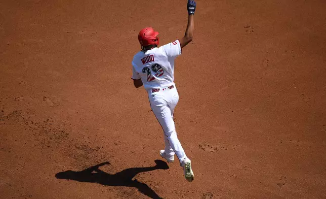 Washington Nationals' James Wood celebrates his solo home run as he rounds the bases during the first inning of a baseball game against the Pittsburgh Pirates, Saturday, July 4, 2026, in Washington. (AP Photo/Nick Wass)