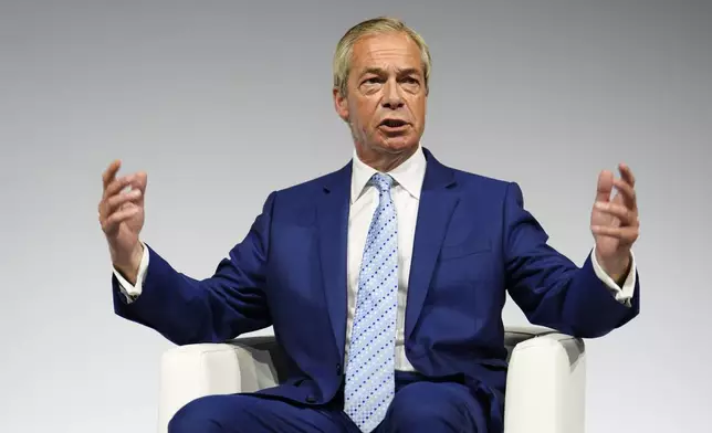 Reform UK leader Nigel Farage gestures during a fireside chat at the Alliance for Responsible Citizenship (Arc) annual conference, at Olympia London, Wednesday June 24, 2026. (Jordan Pettitt/PA via AP)