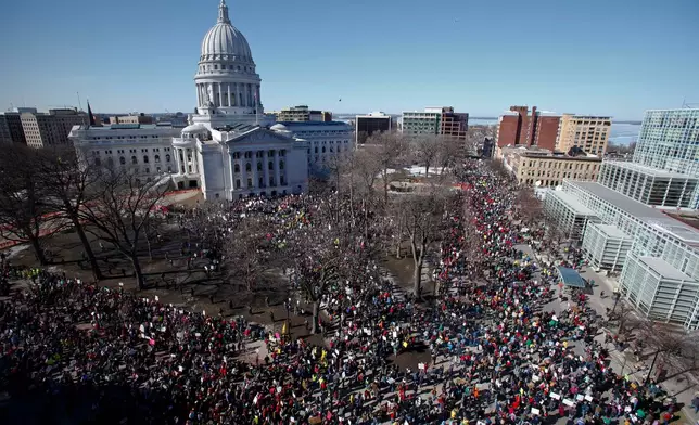 FILE - Protestors, and supporters, of Wisconsin Gov. Scott Walker's bill to eliminate collective bargaining rights for many state workers gather outside the state Capitol in Madison, Wis. on Feb. 19, 2011. (AP Photo/Andy Manis, File)