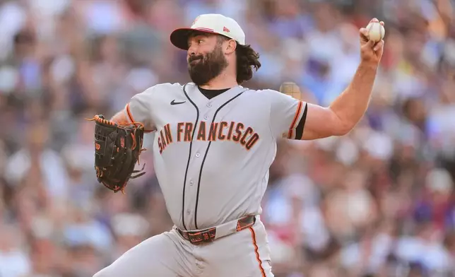 San Francisco Giants starting pitcher Robbie Ray works against the Colorado Rockies in the first inning of a baseball game Saturday, July 4, 2026, in Denver. (AP Photo/David Zalubowski)
