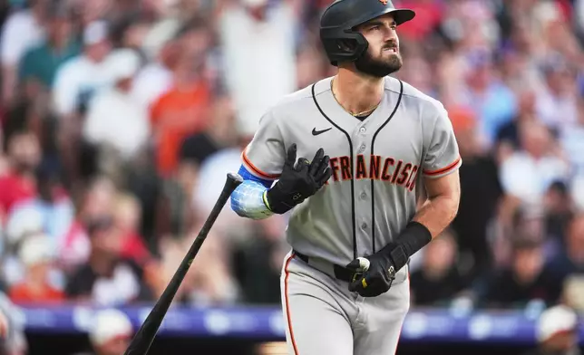 San Francisco Giants' Bryce Eldridge flips his bat as he heads up the first-base line after hitting a solo home run off Colorado Rockies starting pitcher Sean Sullivan in the third inning of a baseball game Saturday, July 4, 2026, in Denver. (AP Photo/David Zalubowski)