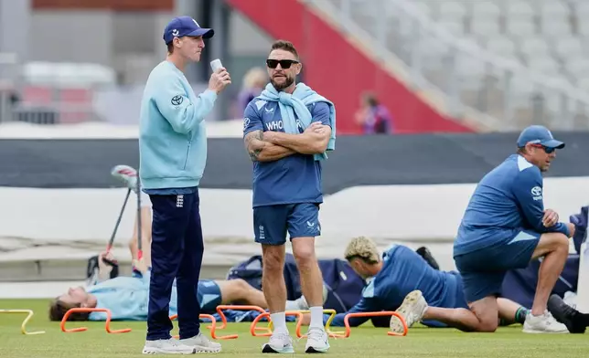 England coach Brendon McCullum, right, chats with England's captain Harry Brook during warmup session before the start of the second T20 cricket match between England and India in Manchester, England, Saturday, July 4, 2026. (AP Photo/Dave Thompson)