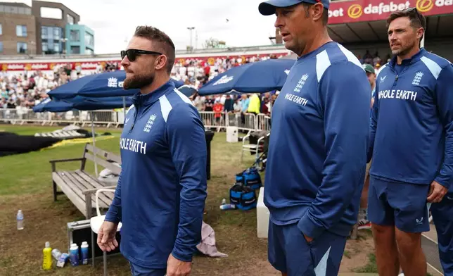 England head coach Brendon McCullum, left, and batting coach Marcus Trescothick stand in dejection as England lose the series against New Zealand on day five of the Third Cricket Test at Trent Bridge Cricket Ground, Nottingham, England, Monday June 29, 2026. (Jacob King/PA via AP)