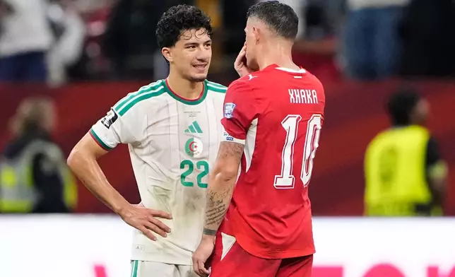 Switzerland's Granit Xhaka (10) and Algeria's Ibrahim Maza (22) talk following during the World Cup round of 32 soccer match between Switzerland and Algeria in Vancouver, British Columbia, Thursday, July 2, 2026. (AP Photo/Lindsey Wasson)