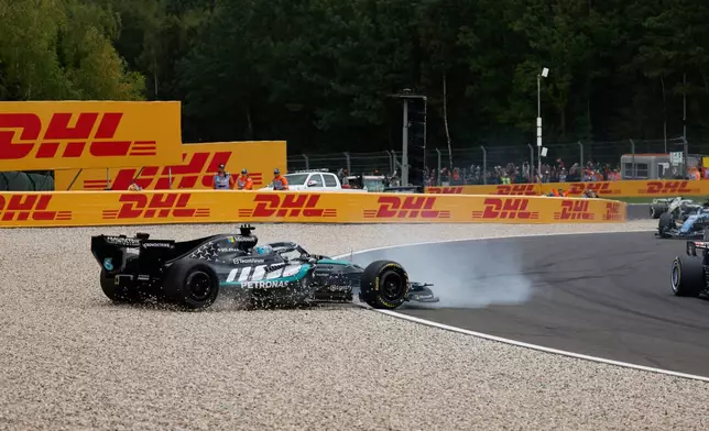 Mercedes driver George Russell of Britain spins off the track during the Formula One Grand Prix at the Spa-Francorchamps racetrack in Spa, Belgium, Sunday, July 19, 2026. (AP Photo/Geert Vanden Wijngaert)