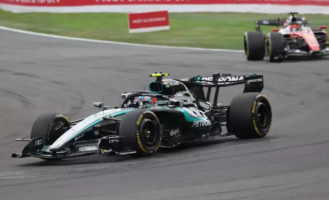 Mercedes driver Andrea Kimi Antonelli of Italy, left, steers his car during the Formula One Grand Prix at the Spa-Francorchamps racetrack in Spa, Belgium, Sunday, July 19, 2026. (AP Photo/Omar Havana)