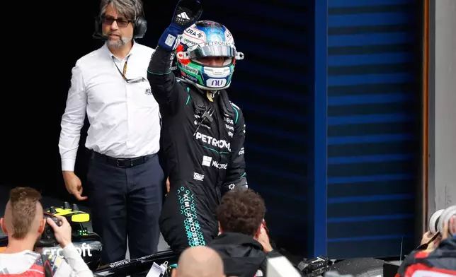 Mercedes driver Andrea Kimi Antonelli of Italy, center, celebrates after winning the Formula One Grand Prix at the Spa-Francorchamps racetrack in Spa, Belgium, Sunday, July 19, 2026. (AP Photo/Geert Vanden Wijngaert)
