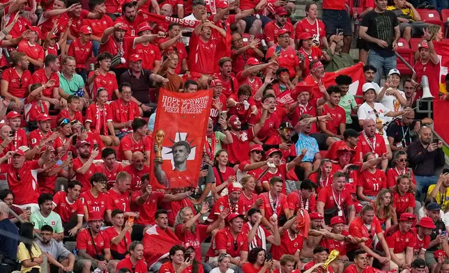 Switzerland fans cheer after defeating Colombia in a penalty shootout during the World Cup round of 16 soccer match in Vancouver, British Columbia, Tuesday, July 7, 2026. (AP Photo/Gregory Bull)