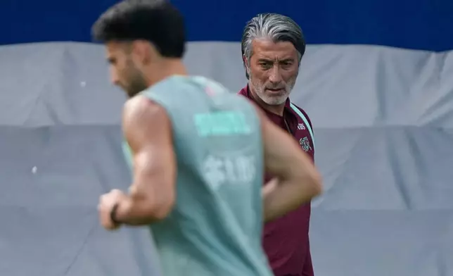 Switzerland head coach Murat Yakin watches training for the World Cup soccer tournament Thursday, July 9, 2026, in Kansas City, Kan. (AP Photo/Charlie Riedel)