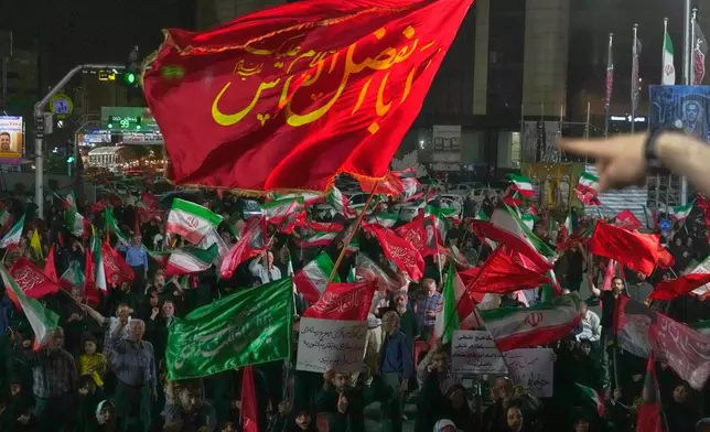 Pro-government demonstrators gather at a square in Tehran, Friday, July 17, 2026. (AP Photo/Vahid Salemi)