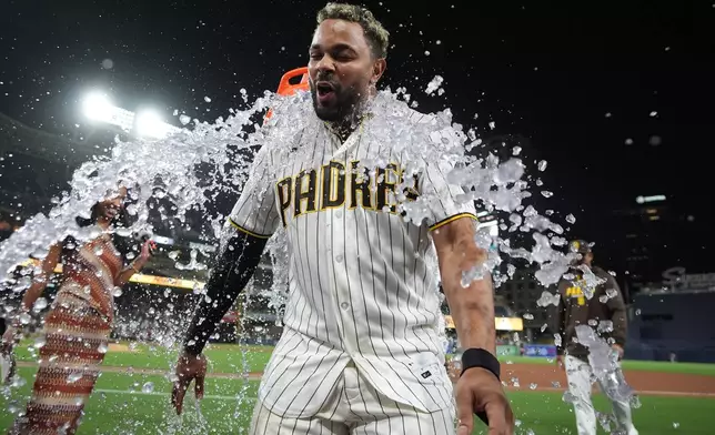 San Diego Padres' Xander Bogaerts celebrates after the Padres defeated the Colorado Rockies 8-7 in a baseball game Tuesday, July 28, 2026, in San Diego. (AP Photo/Gregory Bull)