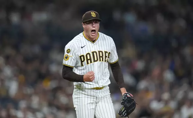 San Diego Padres pitcher Mason Miller celebrates after the third out of the ninth inning of a baseball game against the Colorado Rockies Tuesday, July 28, 2026, in San Diego. (AP Photo/Gregory Bull)