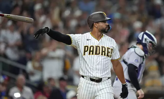 San Diego Padres shortstop Xander Bogaerts watches his sacrifice fly to defeat the Colorado Rockies 8-7 during the ninth inning of baseball game Tuesday, July 28, 2026, in San Diego. (AP Photo/Gregory Bull)