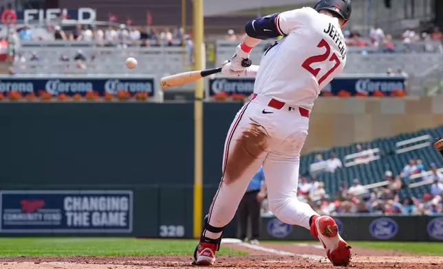 Minnesota Twins' Ryan Jeffers hits a two-run single against the Athletics in the second inning of a baseball game Sunday, July 26, 2026, in Minneapolis. (AP Photo/Bruce Kluckhohn)