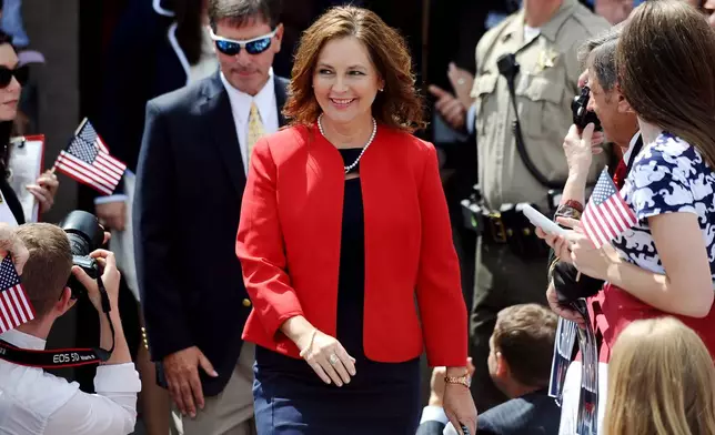 FILE - Darline Graham Nordone, sister of Sen. Lindsey Graham, R-S.C., walks to the stage before his announcement for presidency on Monday, June 1, 2015, in Central, S.C. (AP Photo/Rainier Ehrhardt, File)