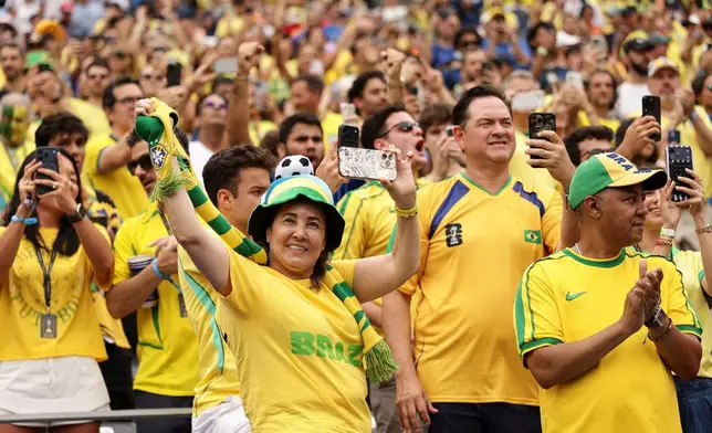 Fans of Brazil cheer from the stands ahead of the World Cup round of 16 soccer match between Brazil and Norway in East Rutherford, N.J., near New York, Sunday, July 5, 2026. (AP Photo/Adam Hunger)