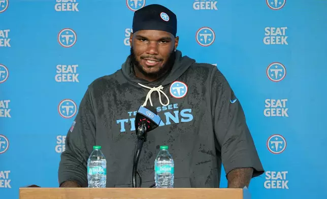 Tennessee Titans defensive lineman John Franklin-Myers speaks at a news conference during the NFL football team's training camp Wednesday, July 29, 2026, in Nashville, Tenn. (AP Photo/George Walker IV)