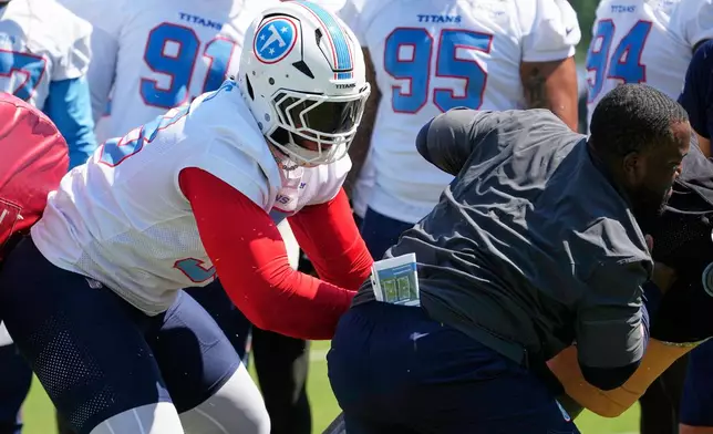 Tennessee Titans defensive tackle Jeffery Simmons runs though a drill during the NFL football team's training camp Thursday, July 30, 2026, in Nashville, Tenn. (AP Photo/George Walker IV)