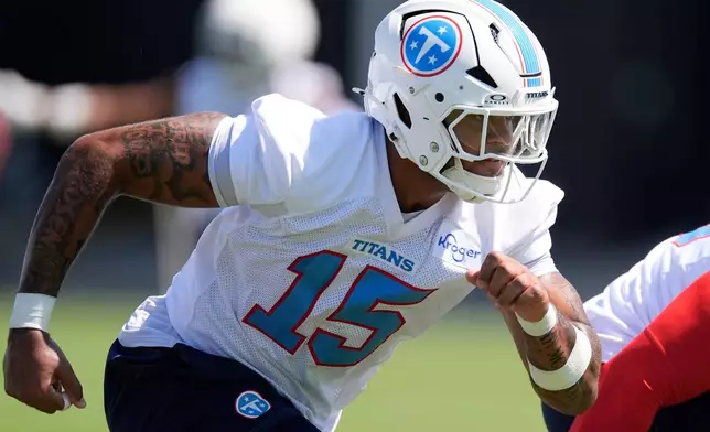 Tennessee Titans defensive end Keldric Faulk (15) runs through a drill during the NFL football team's training camp Thursday, July 30, 2026, in Nashville, Tenn. (AP Photo/George Walker IV)
