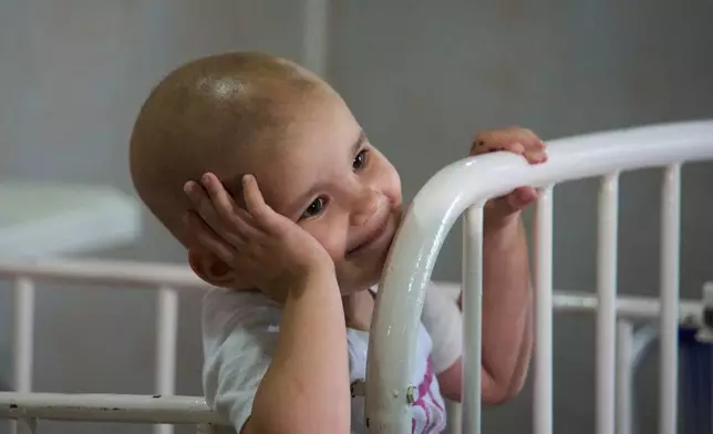Nashly Zerquera, a 4-year-old oncology patient, sits in her bed at the National Institute of Oncology and Radiobiology in Havana, Cuba, Wednesday, June 24, 2026. (AP Photo/Ramon Espinosa)
