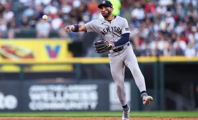 New York Yankees shortstop José Caballero throws to first base during the third inning of a baseball game against the Chicago White Sox in Chicago, Wednesday, July 29, 2026. (AP Photo/Jessie Alcheh)