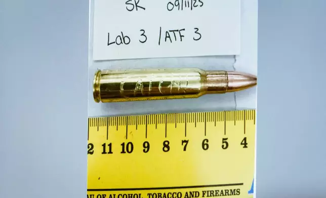 An image of a bullet casing engraved with the word "Catch!" is displayed during a preliminary hearing for Tyler Robinson, who is accused in the fatal shooting of Charlie Kirk, at the Fourth District Courthouse in Provo, Utah, Thursday, July 9, 2026. (AP Photo/Spenser Heaps, Pool)