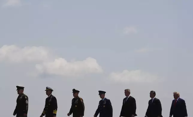 President Donald Trump, far right, and Defense Secretary Pete Hegseth, second from right, attend the dignified transfer of four U.S. service members recently killed in the Middle East, Wednesday, July 22, 2026, at Dover Air Force Base, Del. (AP Photo/Julia Demaree Nikhinson)