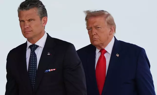 Defense Secretary Pete Hegseth and President Donald Trump attend the dignified transfer of four U.S. service members recently killed in the Middle East, Wednesday, July 22, 2026, at Dover Air Force Base, Del. (AP Photo/Julia Demaree Nikhinson)