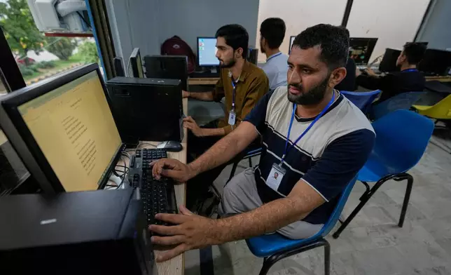 Hamza Ali, 28, who lost both legs in a road accident, attends a computer training class in Islamabad, Pakistan, Wednesday, July 22, 2026. (AP Photo/Anjum Naveed)