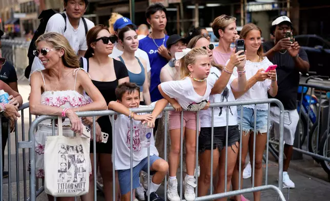 Fans gather outside Madison Square Garden ahead of a reported wedding between Taylor Swift and Travis Kelce on Friday, July 3, 2026, in New York. (Photo by Charles Sykes/Invision/AP)