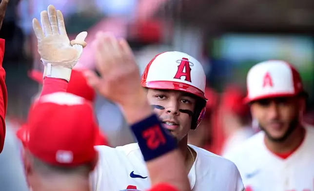 Los Angeles Angels Vaughn Grissom celebrates scoring a run against the Houston Astros during the first inning of a baseball game Wednesday, July 29, 2026, in Anaheim, Calif. (AP Photo/Wally Skalij)